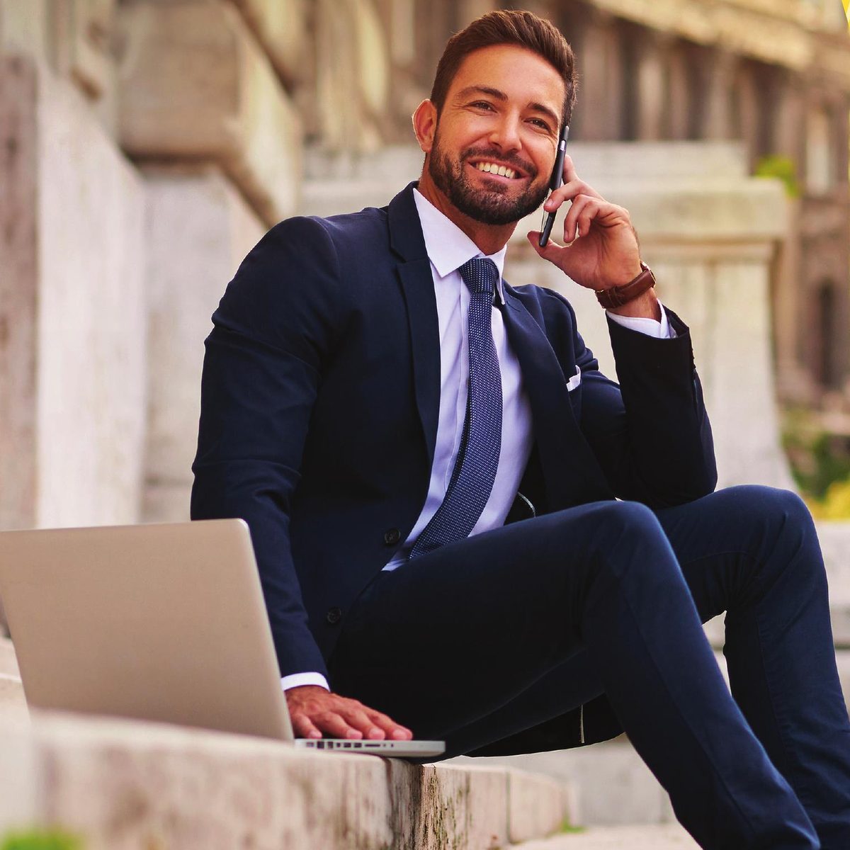 A licensed producer on a call with his laptop, from the carrier’s Opportunity Unlimited brochure